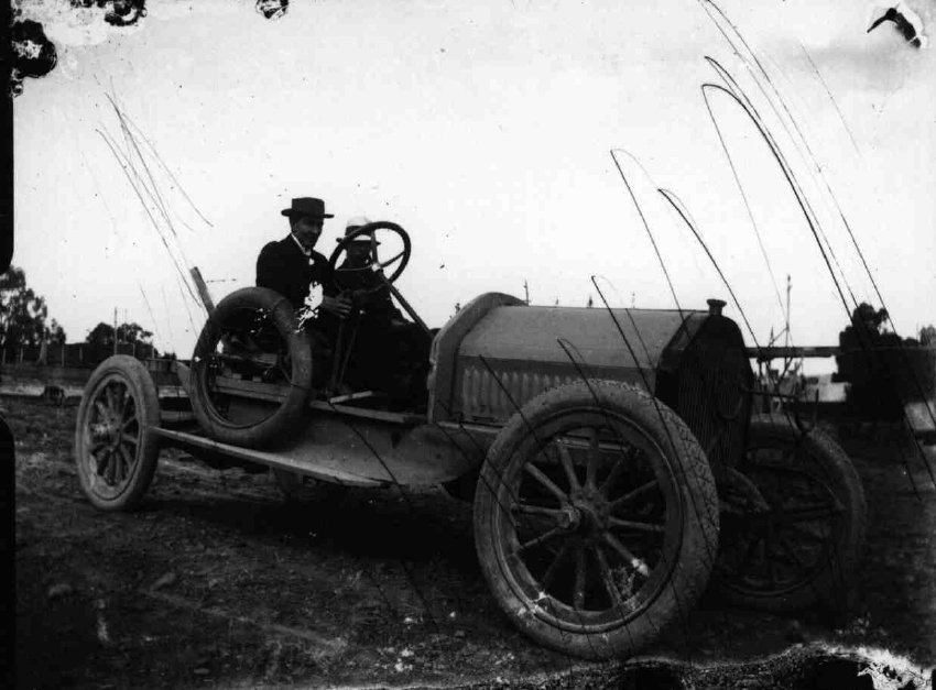 C.A. Bruce, the youngest of two people in the car, 1914