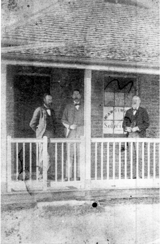 Group on verandah of the original A.W. Simpson, Solicitors, building in Faulkner Street, Armidale