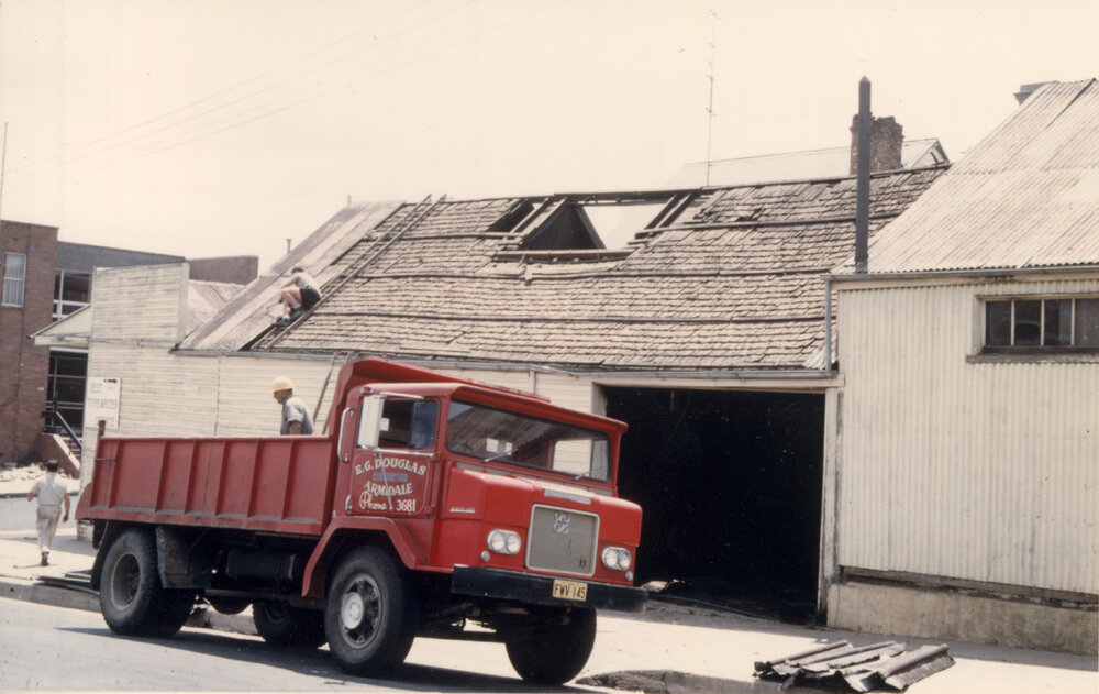 McAvoy's tyre shop, with red truck - E.G. Douglas Contractor, Late 1967