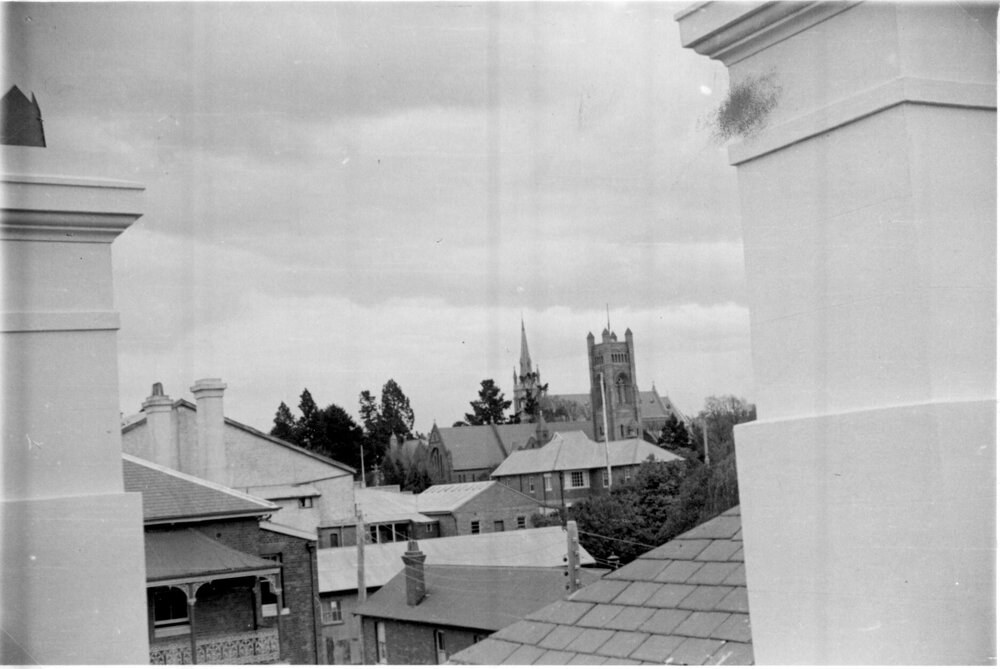 View across rooftops to cathedrals from Post Office roof, 1950s