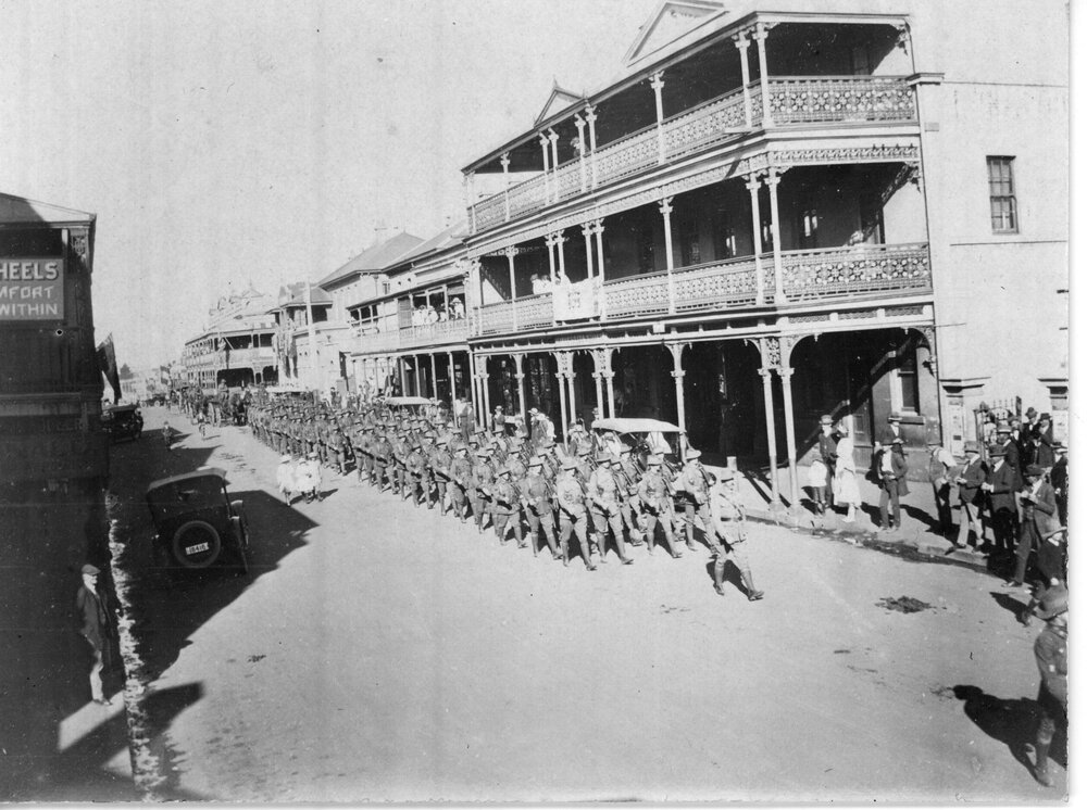 Procession of soldiers with gun carriage, 1919