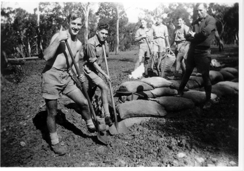 Digging slit trenches north of Booth Block, New England University College