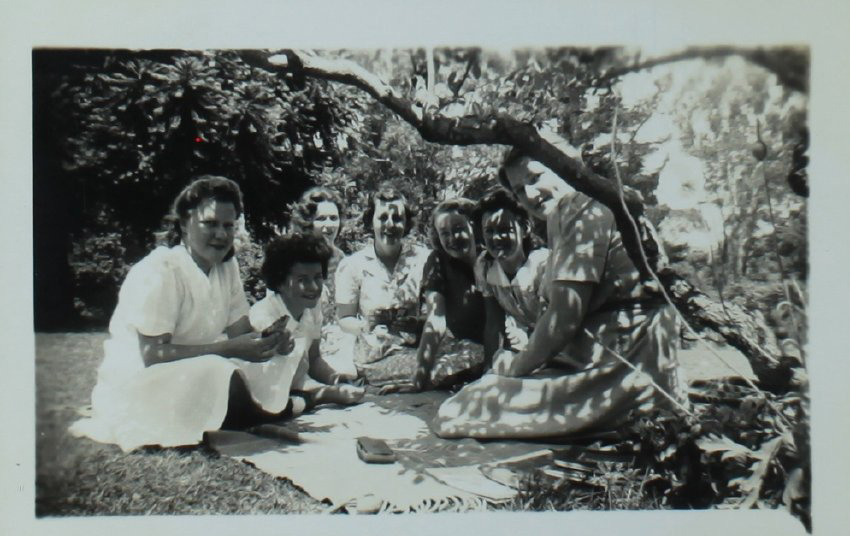 Students on the lawn under a tree NEUC, November 1942