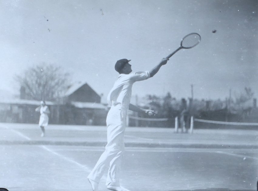 Reg Hoade playing tennis, 1931