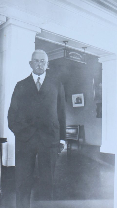 Howard Hinton at the entrance to the Howard Hinton Gallery, Armidale Teachers' College, October, 1933