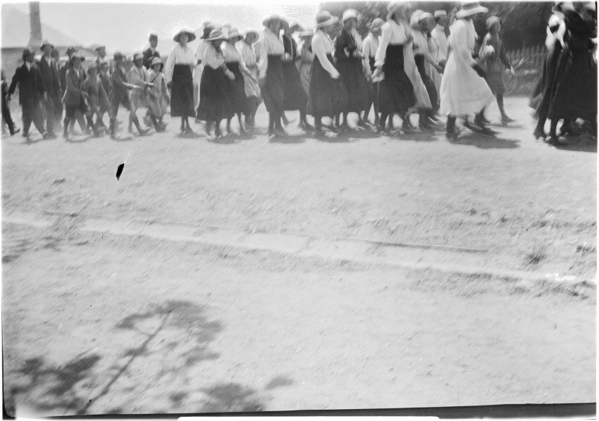 People marching along a street, [c.1919]