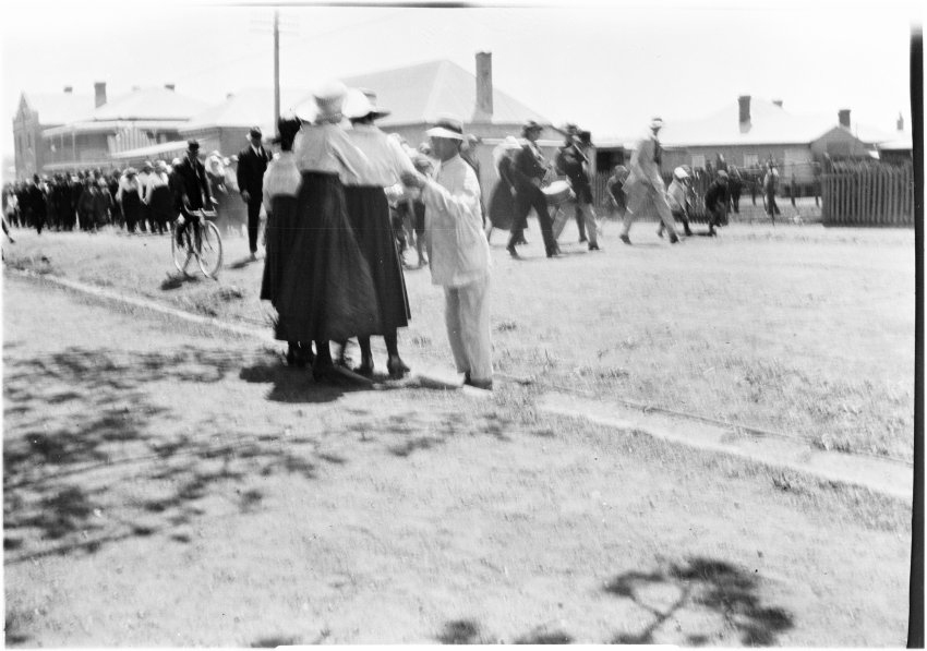 People marching along a street, [c.1919]