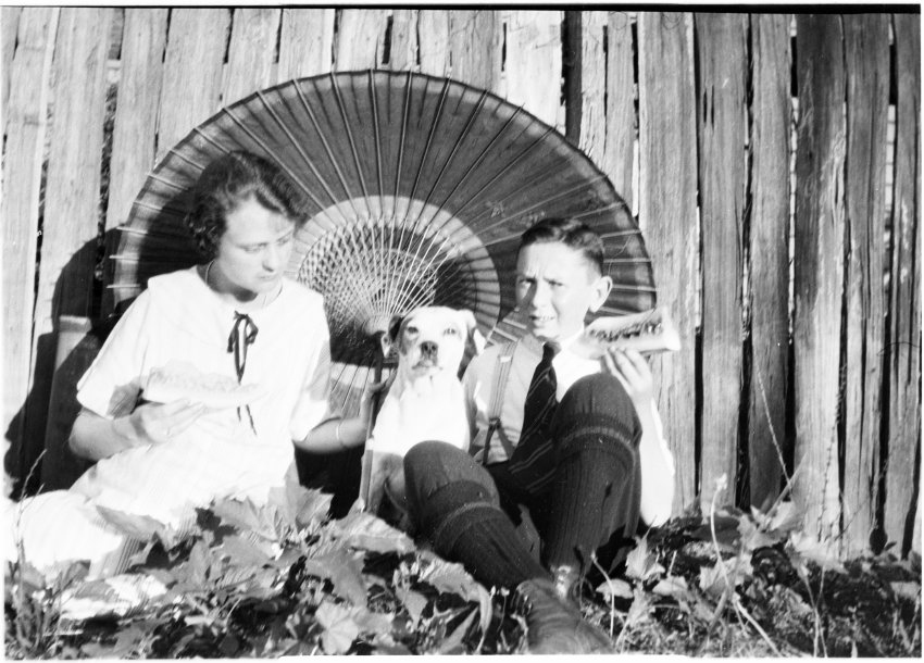 Clare Chamberlain and Ray Jopson with a dog,1920-1922