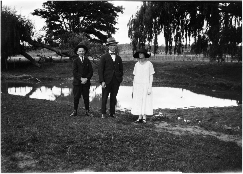 Ray Jopson, Billy Jopson, and Clare Chamberlain by an unidentified dam or billabong