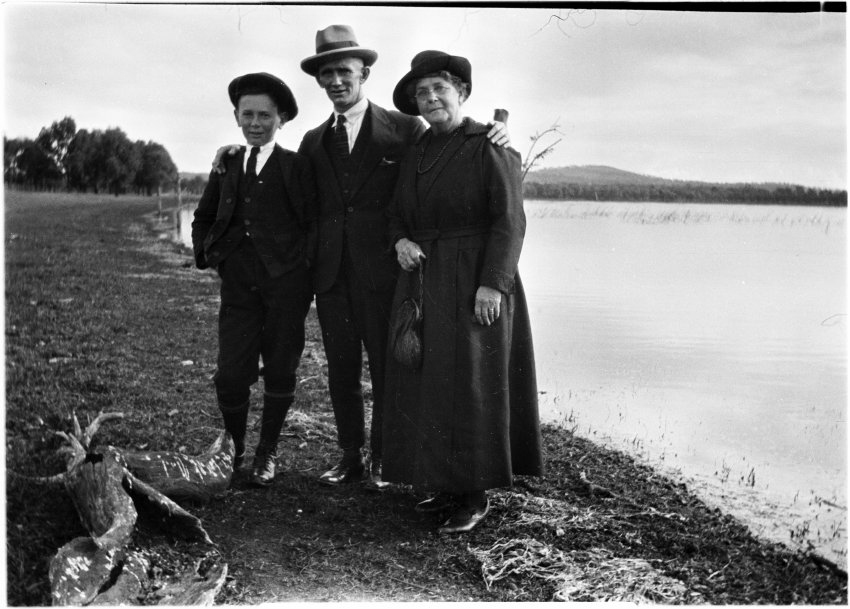 Ray Jopson, Billy Jopson, and [Dora 'Topsy' Chamberlain?] by a dam or billabong