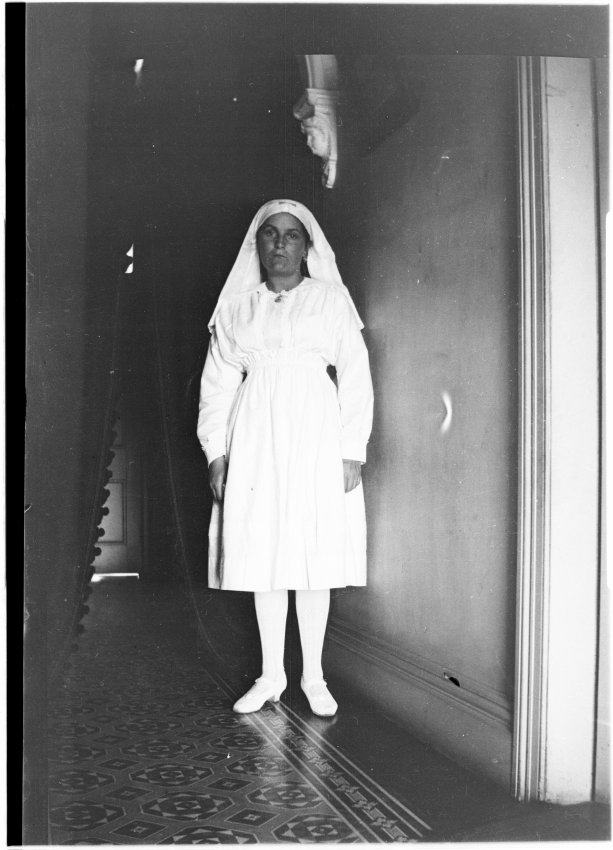 May Chamberlain in the entrance hallway of 63 Barney Street, Armidale