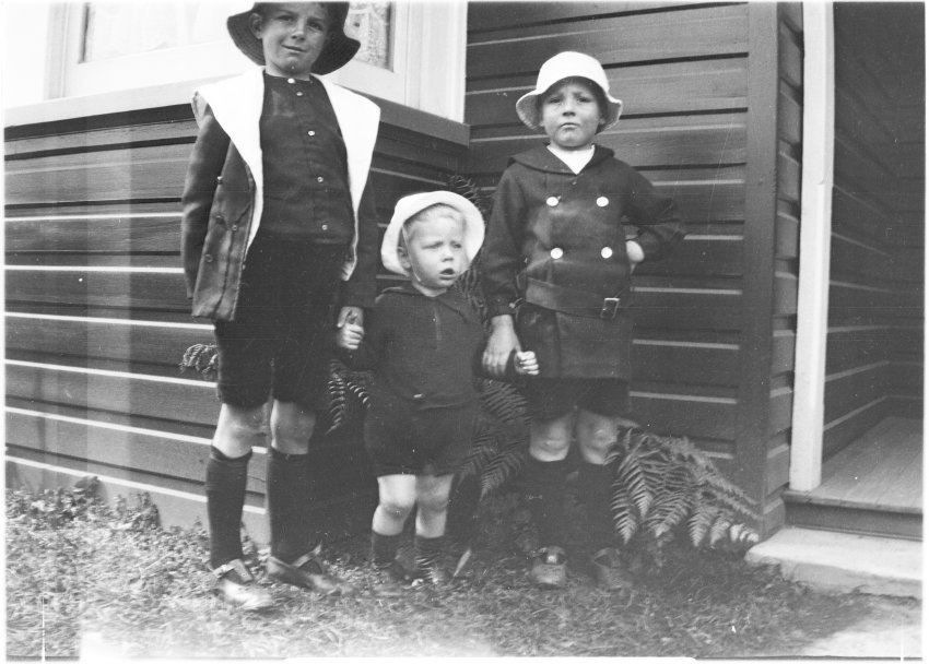Three unidentified children standing in the front garden of 63 Barney Street, Armidale