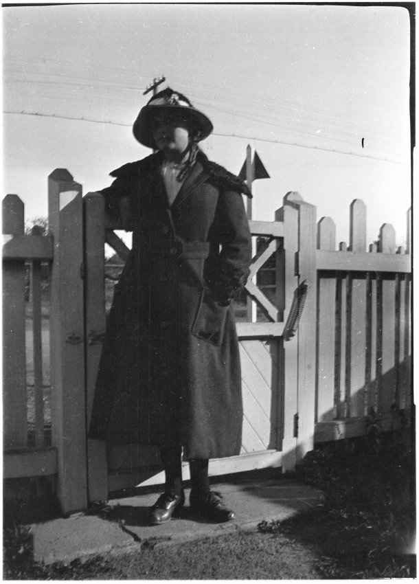 Unidentified woman at the front gate of 63 Barney Street, Armidale