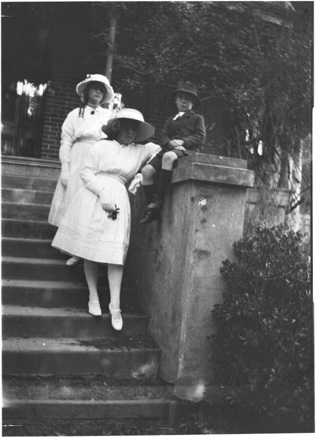 Claire and May Chamberlain with Ray Jopson on the steps