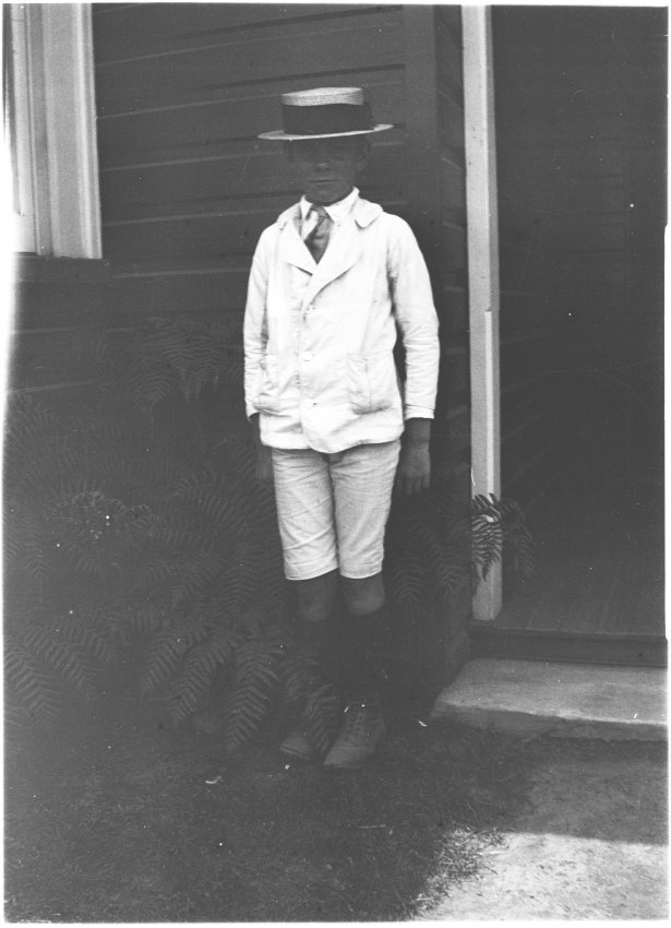 Ray Jopson standing by the front entrance of 63 Barney Street, Armidale