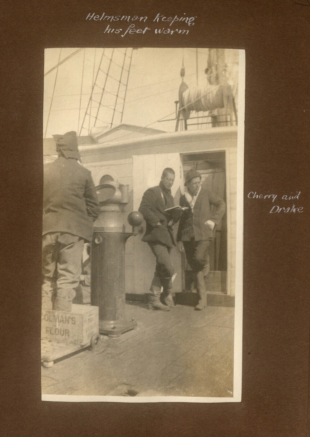 Helmsman keeping his feet warm, showing Cherry and Drake