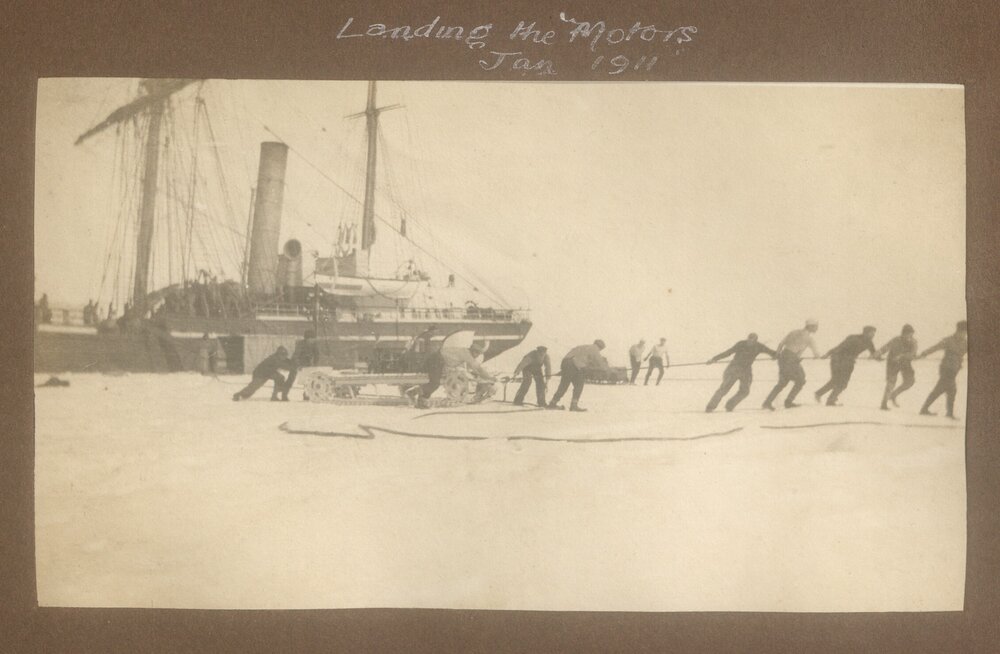 Landing the Motors 11, showing the Terra Nova moored by the ice shelf