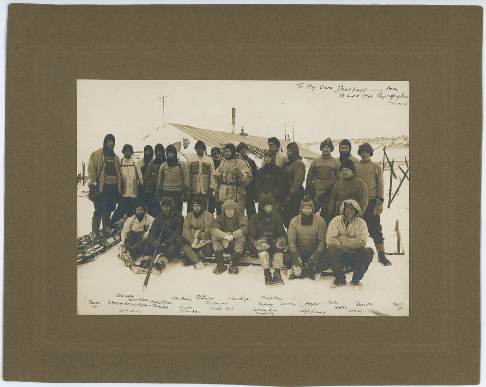 Expedition members outside the hut at Cape Evans