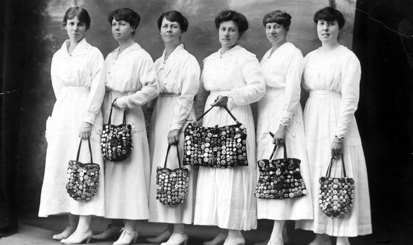 F.J. White's daughters and friends with their WWI badge collections