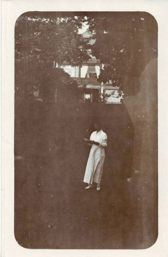 Women reading in front of Terrace House