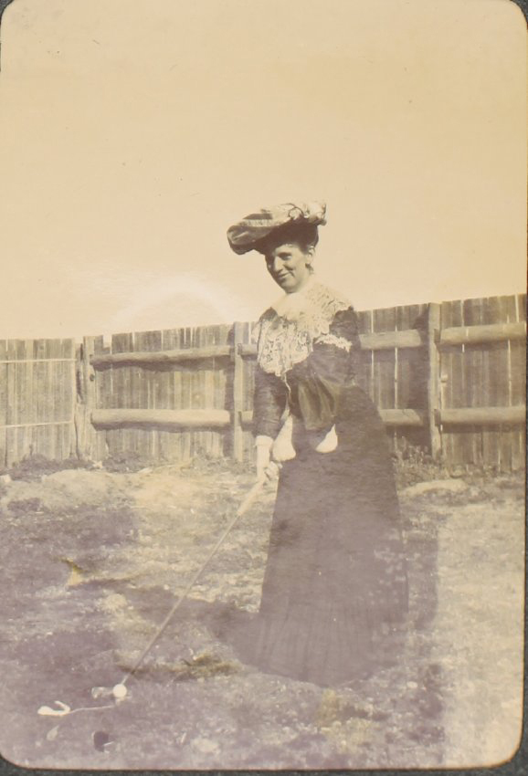 A woman playing golf