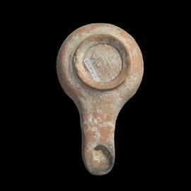 MA2006.9.1 Unglazed terracotta spouted oil lamp