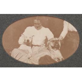 [Woman with two dogs]