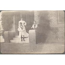 [A woman and two boys]