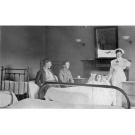 Nurse attending to patients at Booloominbah Convalescent Home