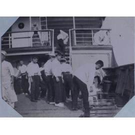 Washing the deck on the Kumano Maru