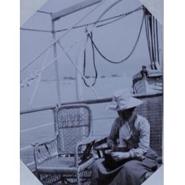 A woman and a wicker chair