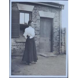 Unidentified woman outside a building