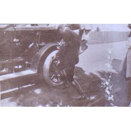Man changing a flat tyre