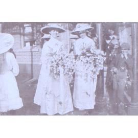 Two women with large bouquets