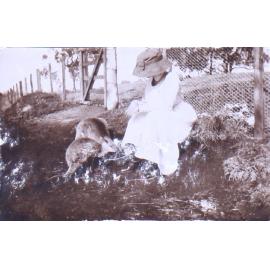 Unidentified woman with two kangaroos