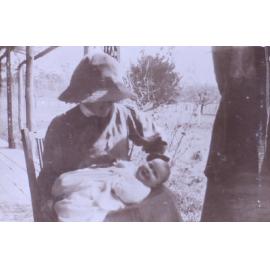 Unidentified woman and baby