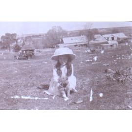 Unidentified girl with a pet dog