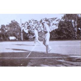 Two unidentified man playing tennis