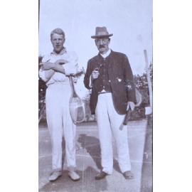 Two unidentified men in tennis clothes