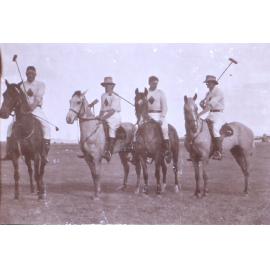 Four unidentified polo players