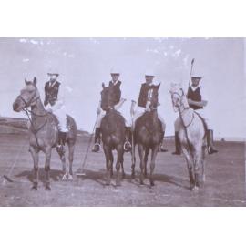 Four unidentified polo players