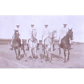 Four unidentified polo players