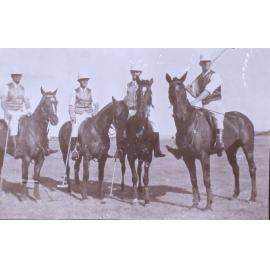 Four unidentified polo players