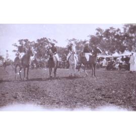 Four unidentified polo players on horseback