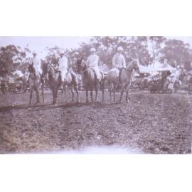 Four unidentified polo players on horseback