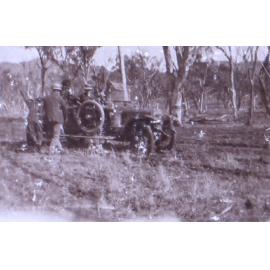 Unidentified men with a car