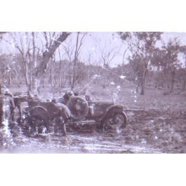 Unidentified people with a bogged car