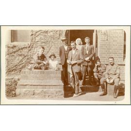 Group of six men and two women outside Booloominbah