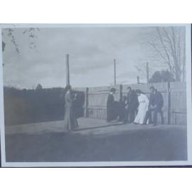 Five unidentified people on a tennis court