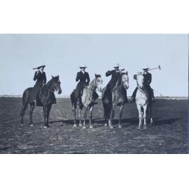 Four women on horseback with polo sticks